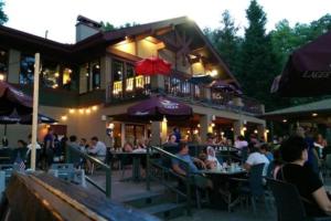 a group of people sitting outside of a restaurant at Big Boulder Bliss in Lake Harmony