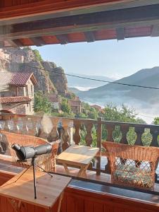 a camera on a balcony with a table and a view at Cal Ferrer Habitatge Rural in Cava