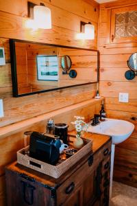 a bathroom with a sink and a microwave at Sakura Ridge the Farm & Lodge in Hood River