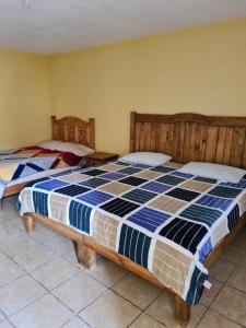 Postel nebo postele na pokoji v ubytování Hotel Villa Aurora