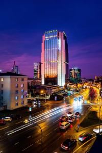 a city skyline at night with cars on a street at Radisson Blu Hotel Ol&uuml;mpia in Tallinn