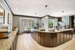 a large kitchen with a large island in the middle at Sonesta ES Suites San Diego - Rancho Bernardo in Rancho Bernardo