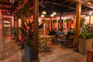 a group of people sitting at tables in a restaurant at Masaya Bogotá in Bogotá