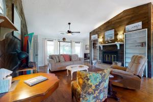 a living room filled with furniture and a fireplace at Our Anchor in St. George Island
