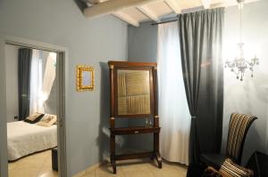 Postel nebo postele na pokoji v ubytování B&B A Casa Dell'Antiquario