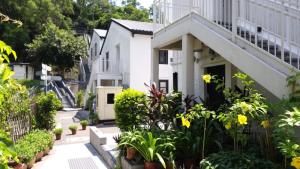 a house with plants in front of it at 饒宗頤文化館 - 翠雅山房 in Hong Kong