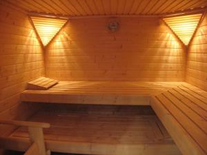 a wooden sauna with a bench in it at Residenz Passat Cuxhaven 4 in Cuxhaven