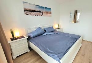 Ein Bett oder Betten in einem Zimmer der Unterkunft Villa Linde