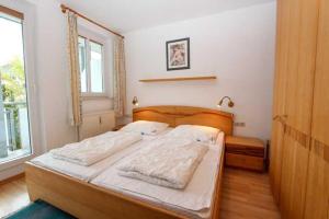 Ein Bett oder Betten in einem Zimmer der Unterkunft Villa Linde