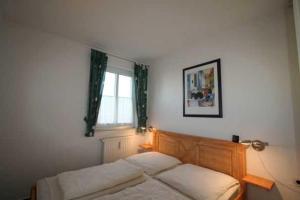 Ein Bett oder Betten in einem Zimmer der Unterkunft Villa Linde