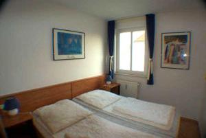 Ein Bett oder Betten in einem Zimmer der Unterkunft Villa Linde