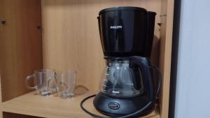 a black blender sitting on top of a shelf at Tan Ushuaia in Ushuaia