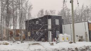 a house is being built in the snow at Tan Ushuaia in Ushuaia