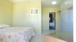 Casarão Com 3 suítes, 2 quartos, Piscina, Praia Perto客房内的一张或多张床位