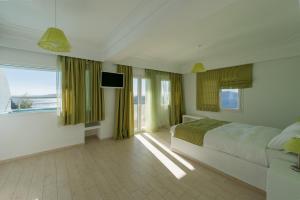 Postel nebo postele na pokoji v ubytování Tzekos Villas