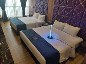 Postel nebo postele na pokoji v ubytování U3 HOTEL