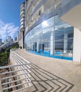 a view of a building with glass windows at Euromarina 2 Reñaca Vista al Mar in Viña del Mar