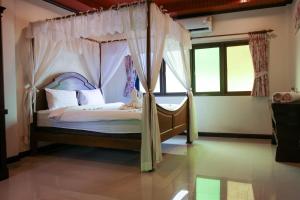 Postel nebo postele na pokoji v ubytování Namphung Phuket Boutique Resort + 113 fotografií