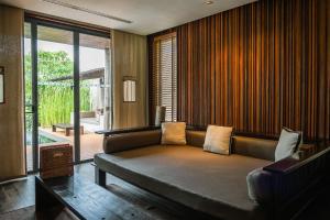 Posezení v ubytování MUTHI MAYA Forest Pool Villa Resort - SHA Plus Certified