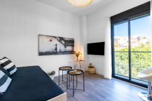 Televízia a/alebo spoločenská miestnosť v ubytovaní Apartamento Don Rodrigo