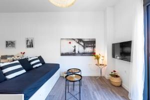 Televízia a/alebo spoločenská miestnosť v ubytovaní Apartamento Don Rodrigo