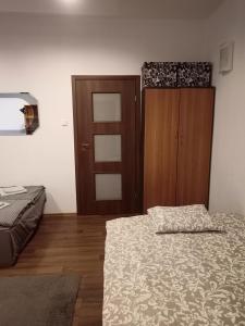 Posteľ alebo postele v izbe v ubytovaní Kamienica przy Staszica