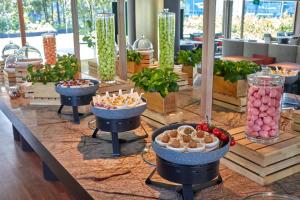 a buffet of food on a table in a restaurant at PARKROYAL COLLECTION Marina Bay, Singapore in Singapore