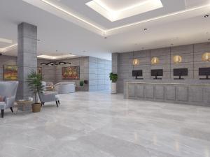 a lobby with a reception desk in a building at Zone By The Park Pathankot in Pathānkot