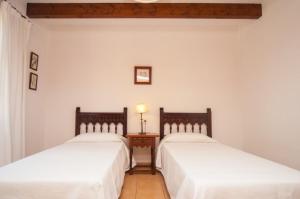Postel nebo postele na pokoji v ubytování Villa Tia + 5 fotografií