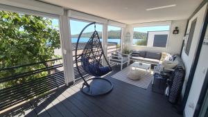 En balkon eller terrasse på O'Fig mobile home