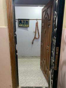 a door leading into a room with a hallway at Azzam Guest House 1 families only in Fayoum