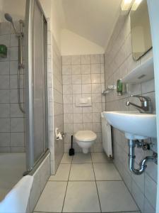 a bathroom with a sink and a toilet at Silvio-Gesell-Tagungsstätte in Wuppertal