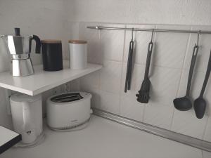 A kitchen or kitchenette at Albir cosy apartment