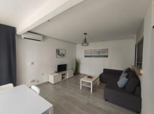 A seating area at Albir cosy apartment