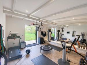 a gym with exercise equipment in a room at Little Owl A beautiful bolt-hole for couples in Aldeburgh