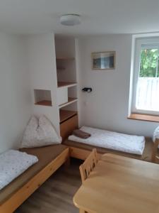 Postel nebo postele na pokoji v ubytování Penzion Samoty