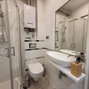 Koupelna v ubytování Apartament Tuwima