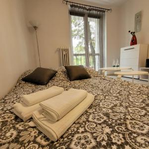 Postel nebo postele na pokoji v ubytování Apartament Tuwima