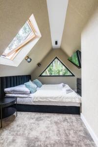 Postel nebo postele na pokoji v ubytování Aparthome Tatra