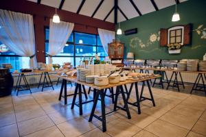 a dining room with a table with dishes on it at Standard Apartments Terme Sveti Martin in Sveti Martin na Muri
