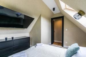 Postel nebo postele na pokoji v ubytování Aparthome Tatra