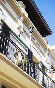 a building with a balcony with a black railing at Cal Peó ByBCardedeu in Cardedeu
