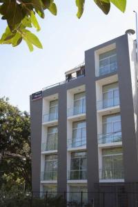 a tall building with balconies on the side of it at The Park Slope Hotel in Bengaluru