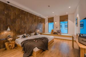 Postel nebo postele na pokoji v ubytování Lijiang Snow Mountain Bengu Hotel-Shuhe Ancient Town Branch 丽江雪山奔鼓酒店-束河古镇店