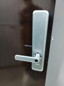 a close up of a door handle on a door at Banana Muji Home-C6 in Ban Song Hong