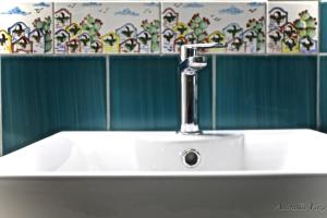 a white sink with a faucet in a bathroom at Casa Maddy Amalfi Coast in Atrani