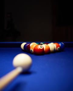 a group of billiard balls on a pool table at Hótel Kría in Vík