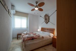 Posteľ alebo postele v izbe v ubytovaní Apartamento Tribalia Cadiz