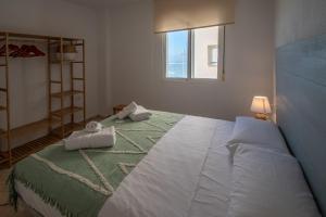 Posteľ alebo postele v izbe v ubytovaní Apartamento Tribalia Cadiz