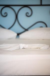 Voodi või voodid majutusasutuse Manos Rooms toas